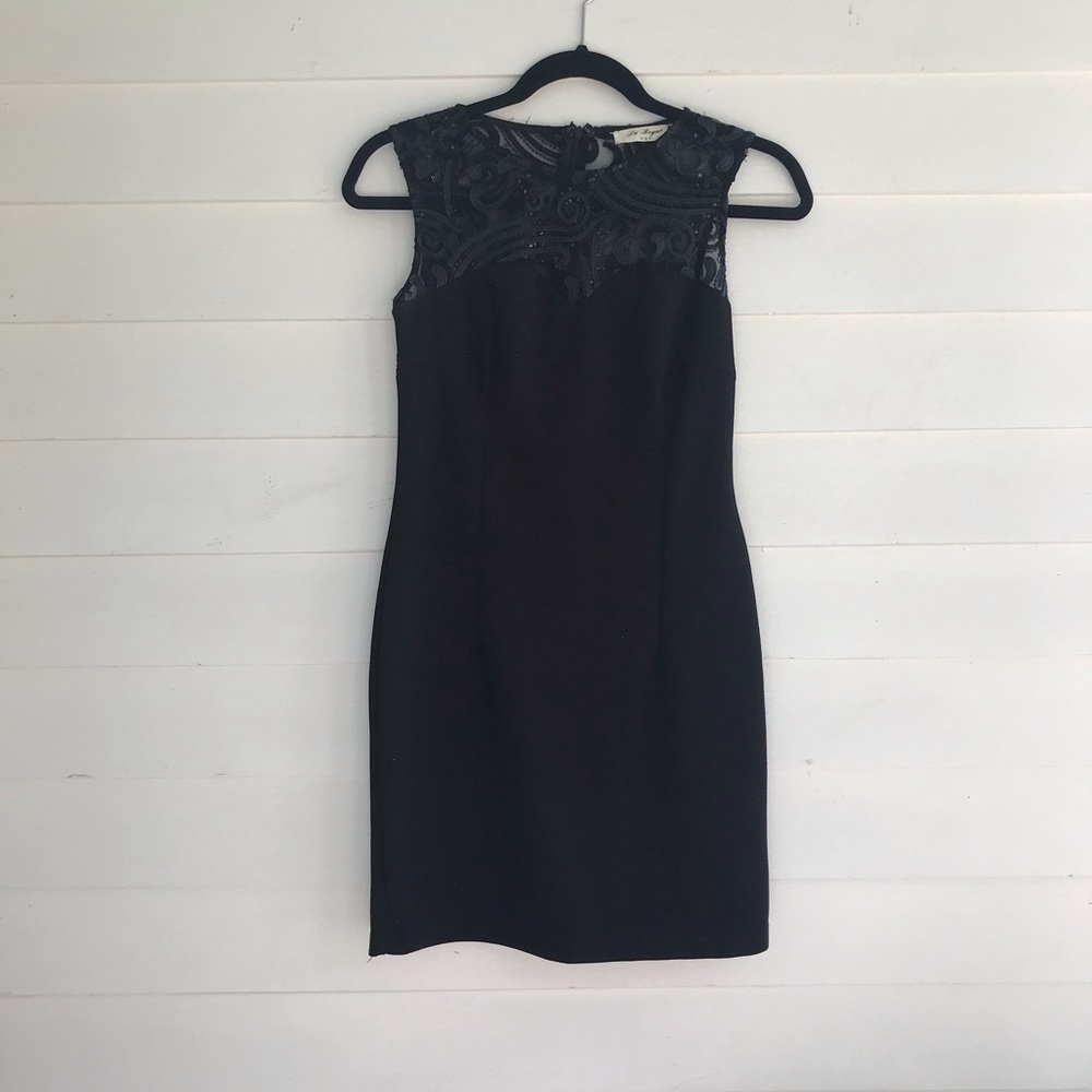 Fitted black dress with sheer sequin top